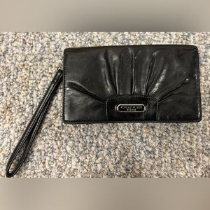 Black wallet with pink interior.